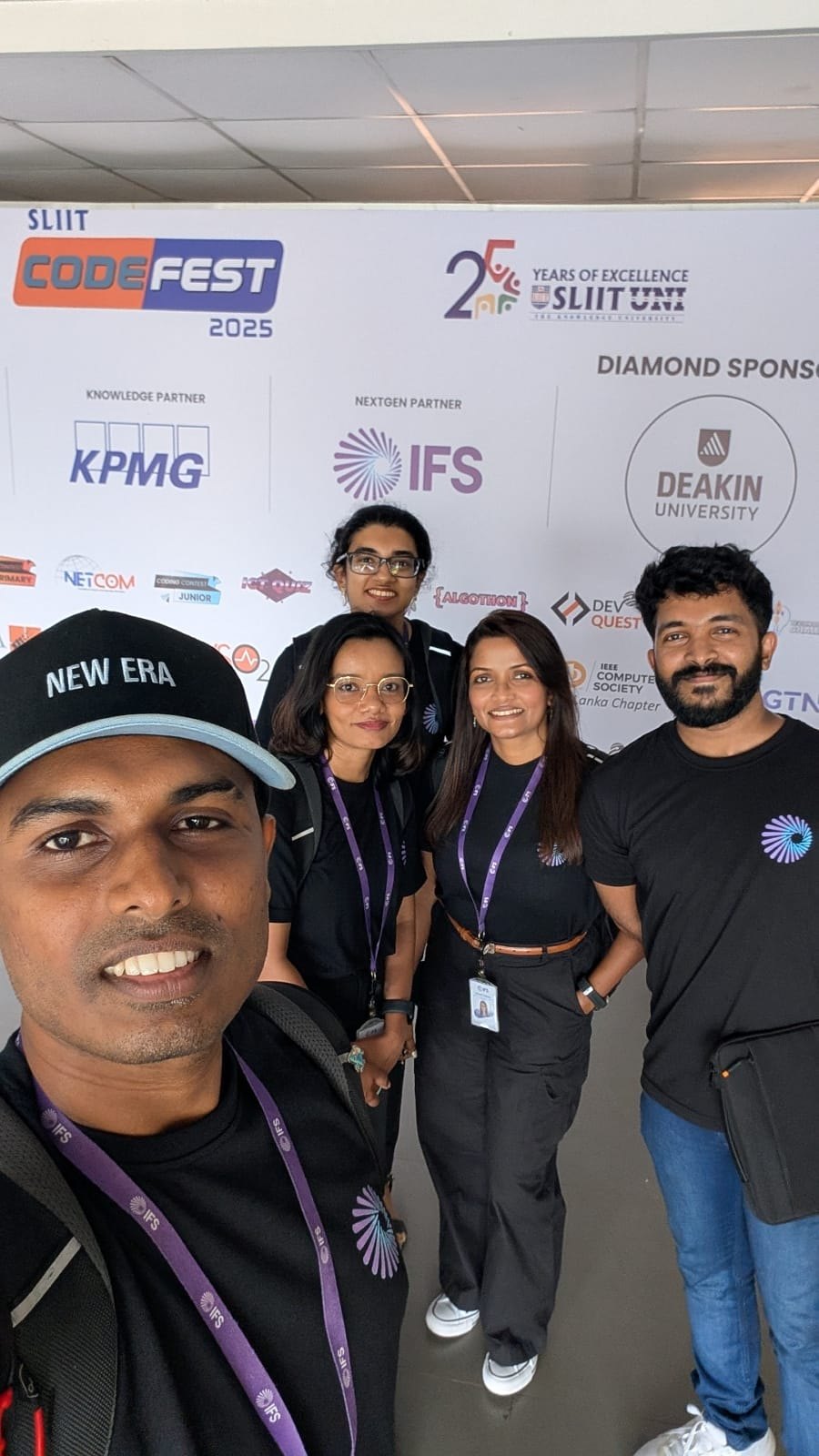 The IFS team at the SLIIT Codefest 2025 sponsor backdrop